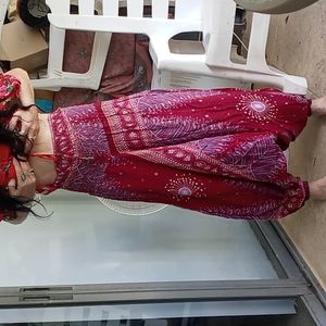 NWOT Burgandy Gypsy Harem pants. Printed with feather like designs